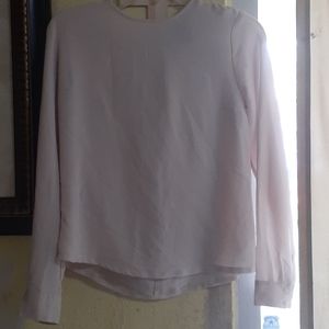 Tan long sleeved shirt.